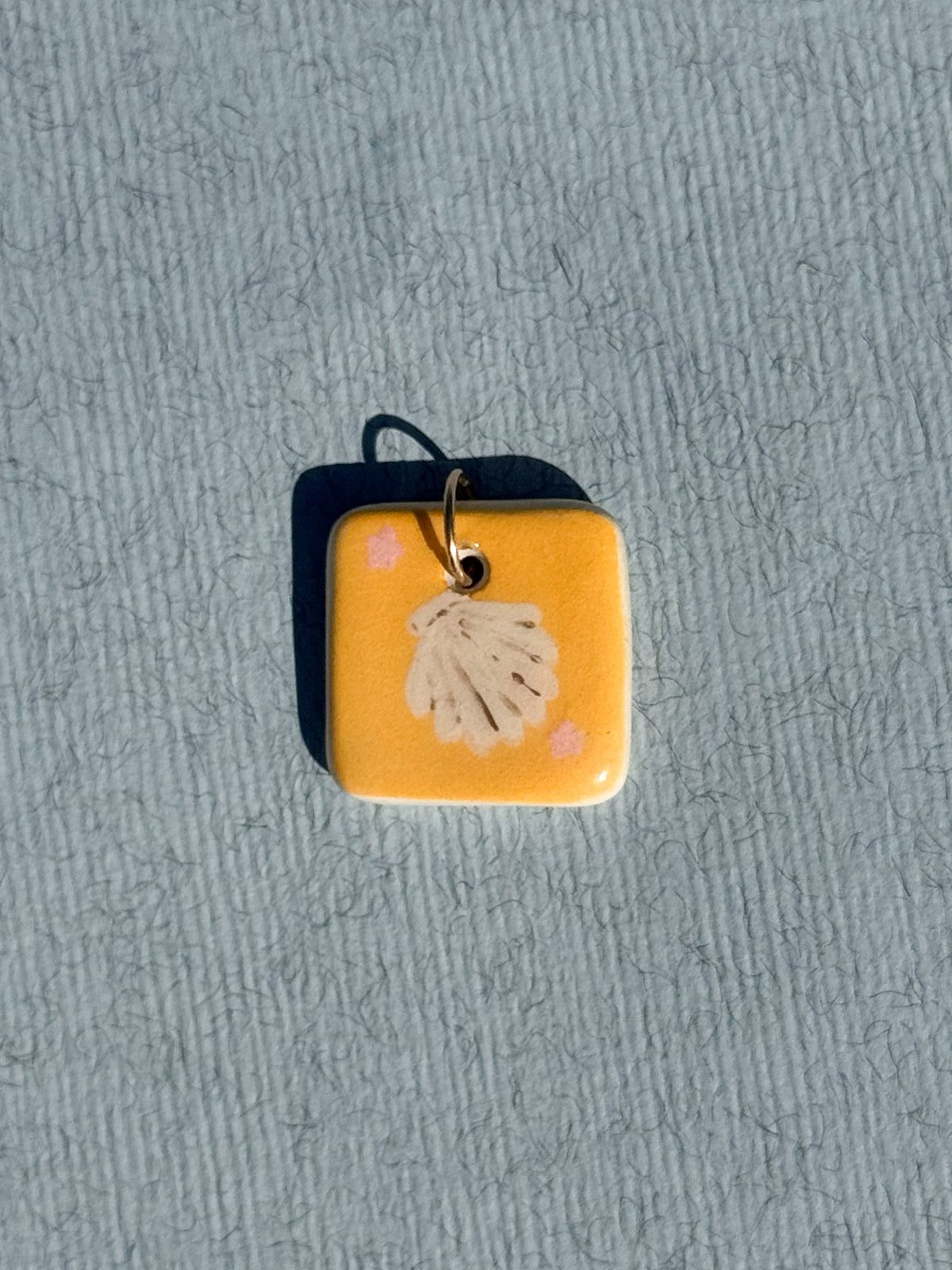 Le coquillage - Médaillon + Carte postale