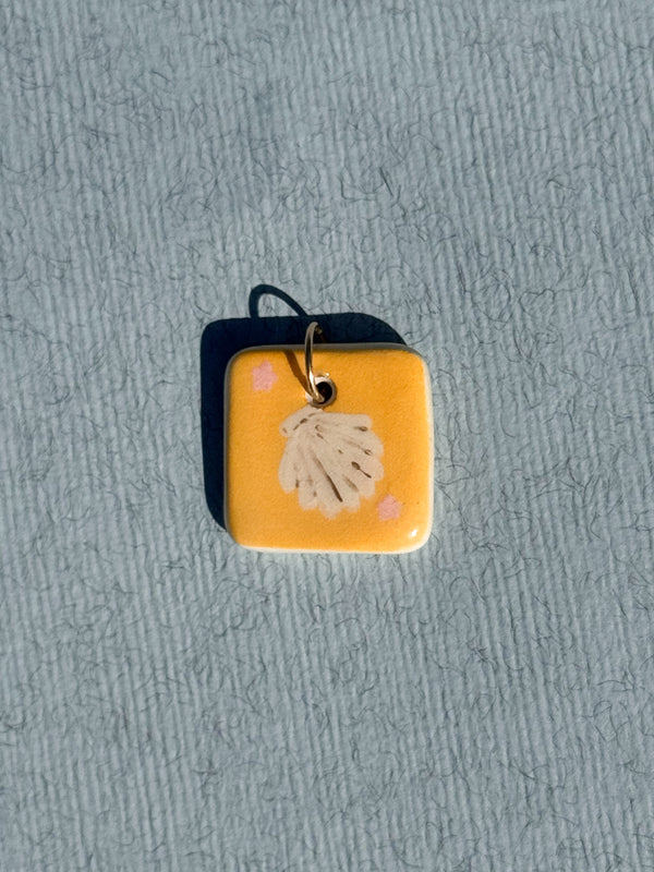 Le coquillage - Médaillon + Carte postale